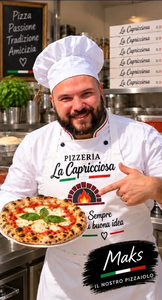 Maks, pizzero de La Capricciosa, con una pizza Margherita